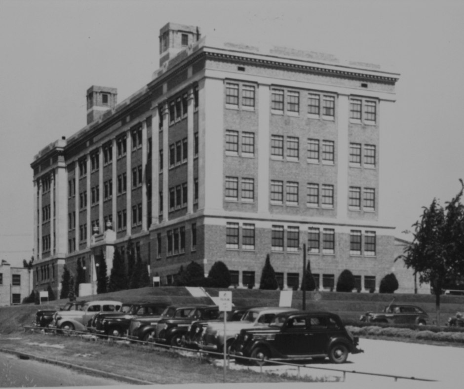 collecge of medicine first building in black and white.
